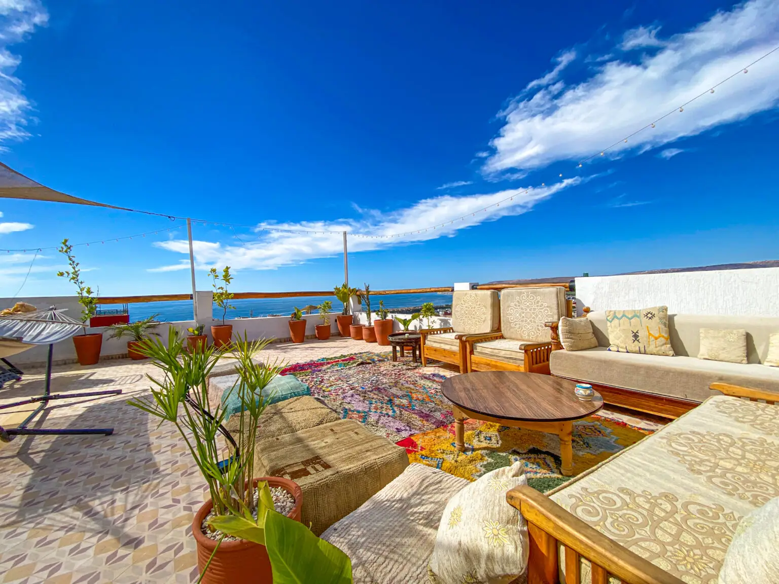 Surf camp Tamraght rooftop terrace ocean views Taghazout Bay Morocc