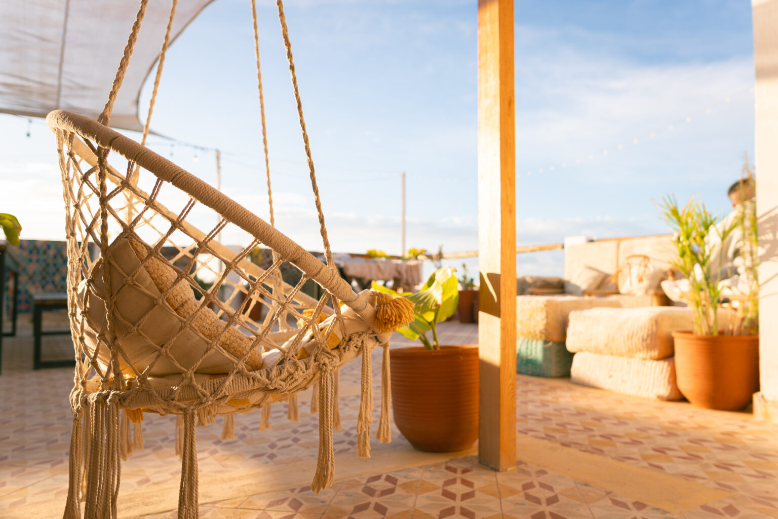 Expert surf guide Morocco briefing intermediate surfers before session Tamraght beach local spot knowledge