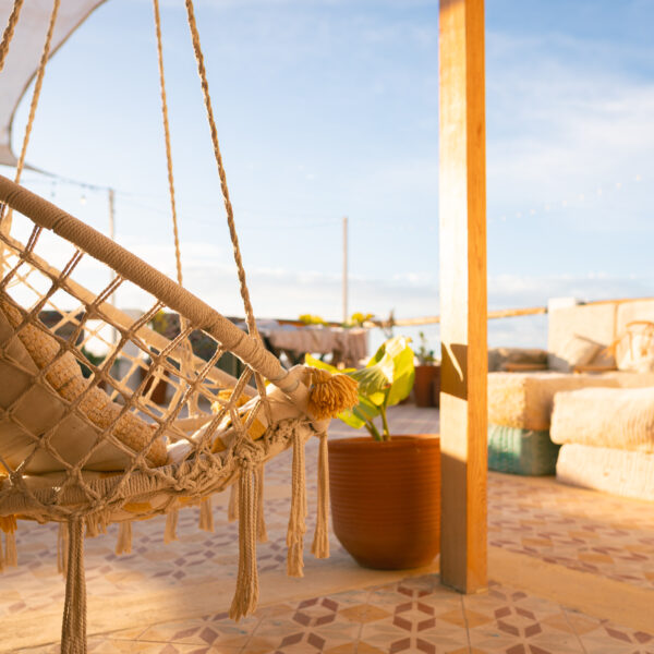 Expert surf guide Morocco briefing intermediate surfers before session Tamraght beach local spot knowledge