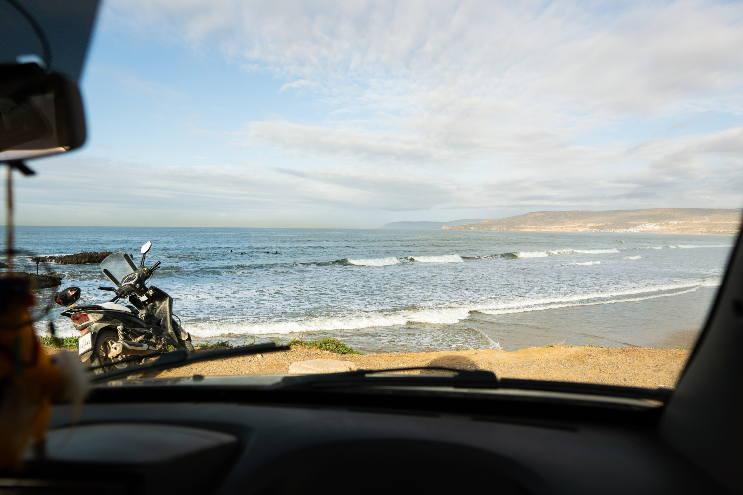 Surf guide Morocco beach briefing small group 6-8 surfers Tamraght lineup explanation spot conditions daily
