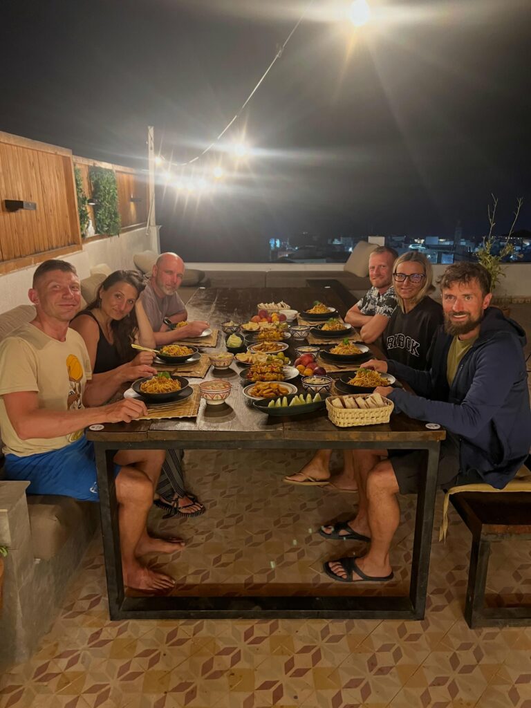 Surf camp guests sharing a meal together