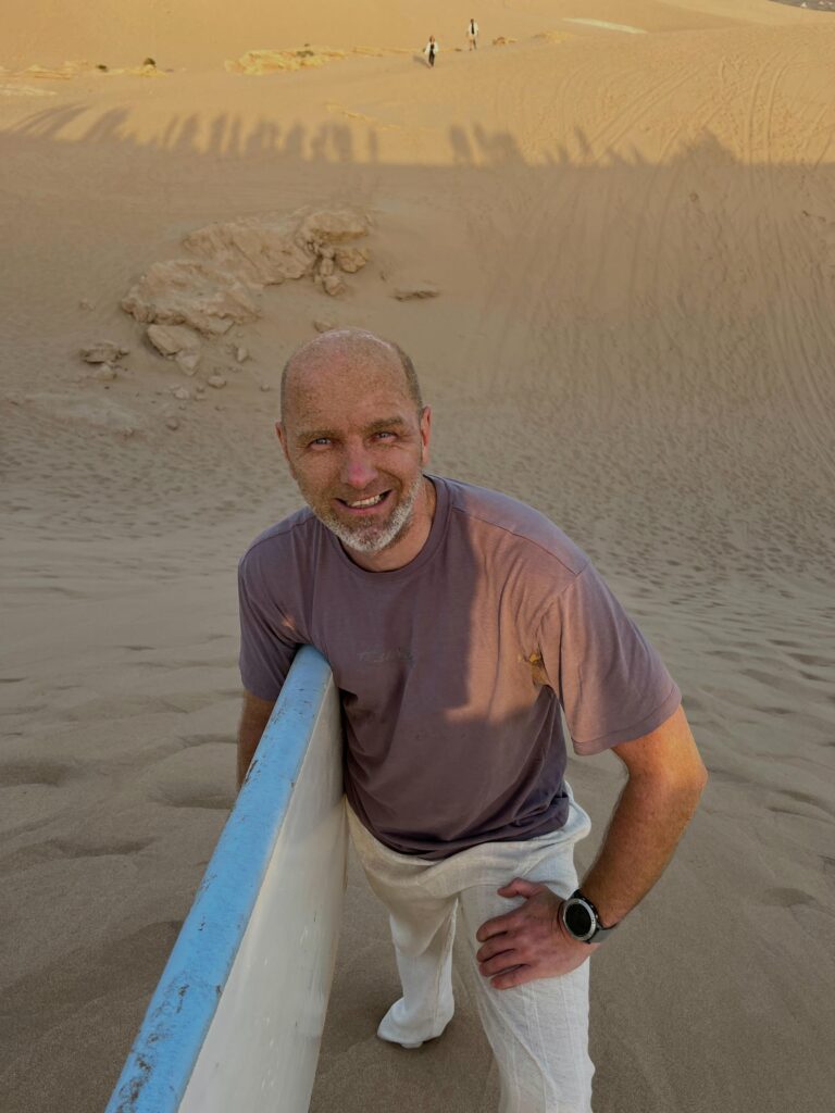 Smiling surf camp guest on the beach
