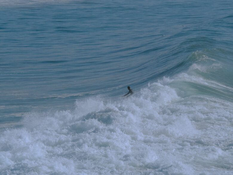 Surfer riding a wave in Taghazout, Morocco